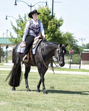 Pictured here is H&J Equine natural horse supplement co-founder, Jeri, with her horse Moonshine.